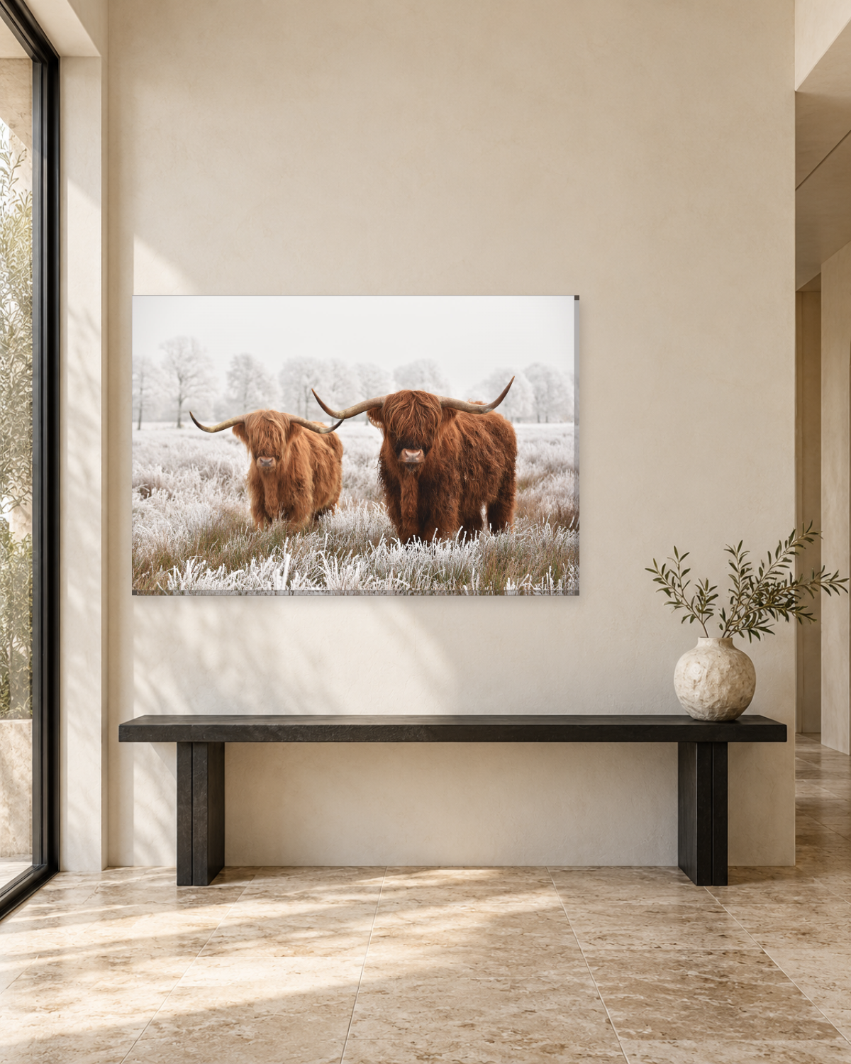 Highland cows canvas hung above a sofa