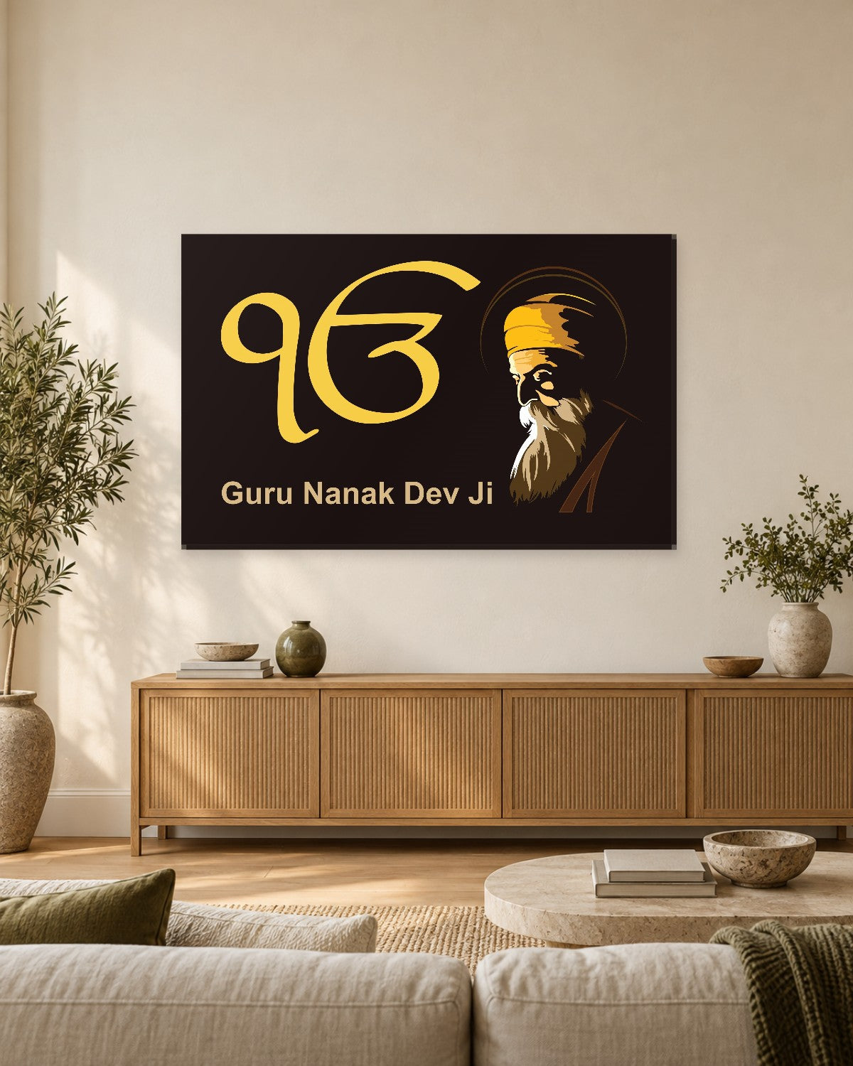 Guru Nanak Dev Ji and Ek Onkar gold on black canvas in a warm living room