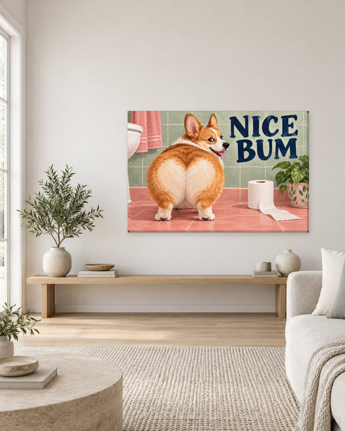 Fluffy corgi looking back at its round bottom beside Nice Bum lettering in a pink bathroom – funny bathroom canvas wall art