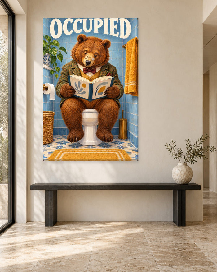 Brown bear in glasses and a bow tie reading a book on the toilet under an Occupied sign – funny bathroom canvas
