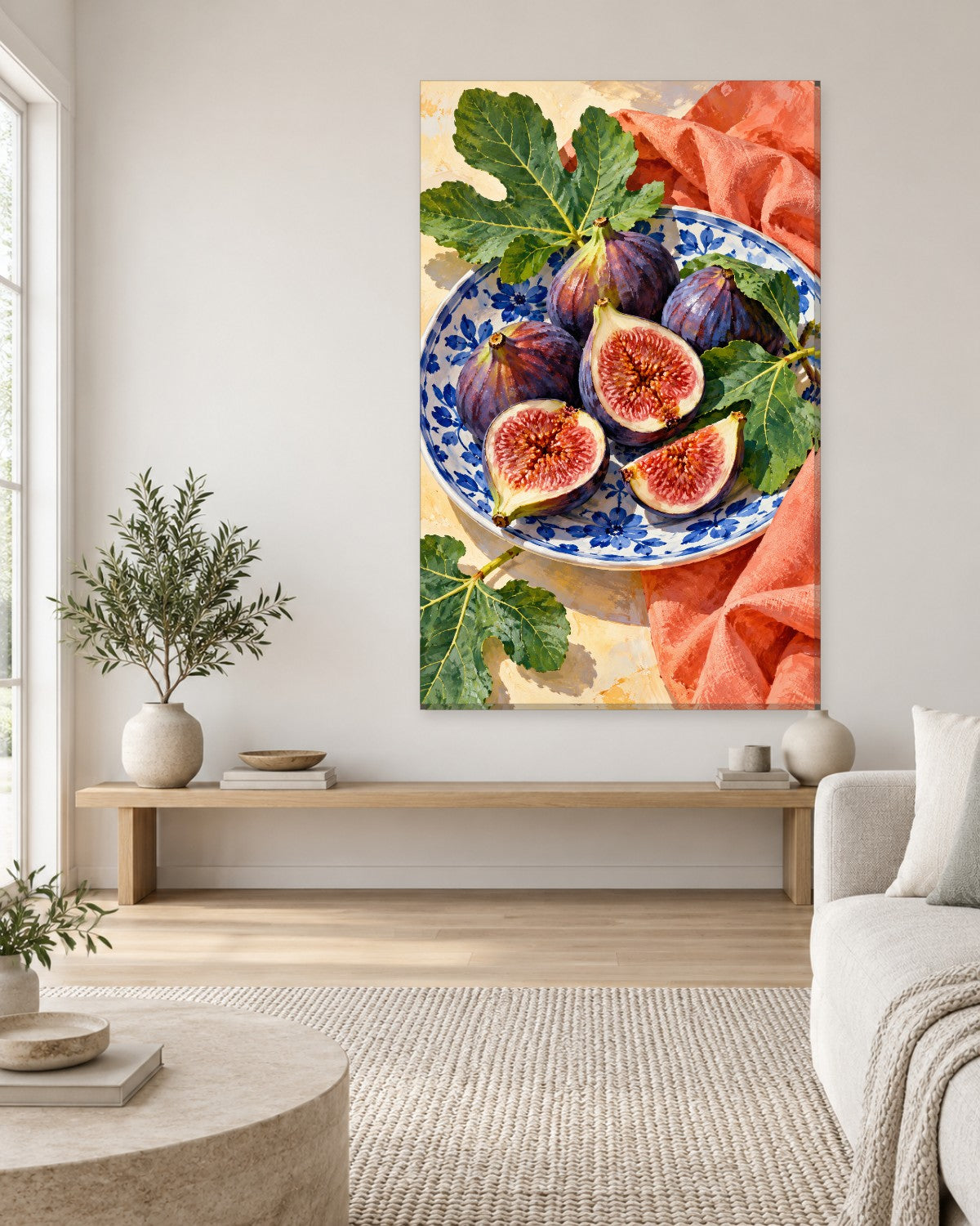 Whole and halved purple figs on a blue and white floral plate with fig leaves, seen from above – tall kitchen canvas