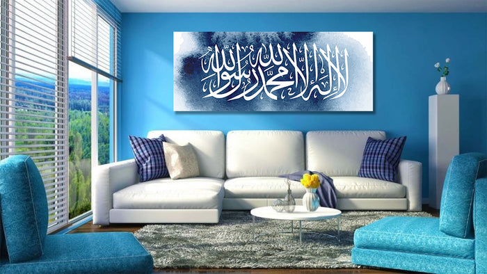 Blue watercolour Shahada Islamic canvas displayed above a sofa